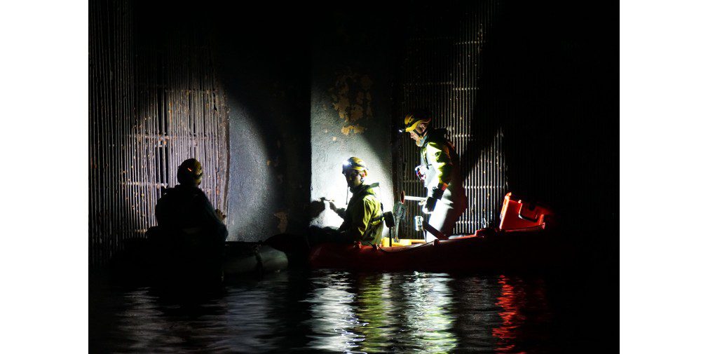 Scan Survey staff working on rafts in the dark