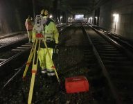 scan survey staff member working with terrain modelling and detailed measurement within a train tunnel